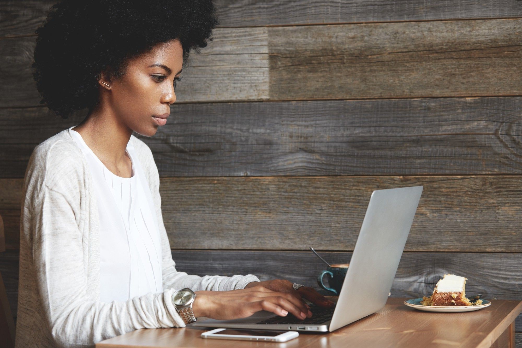 banner image of a woman on her laptop